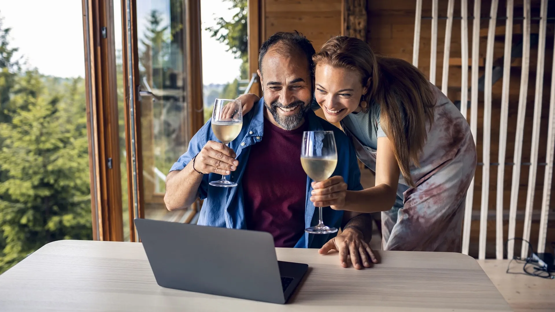 Couple having a video call on their laptop stock photo