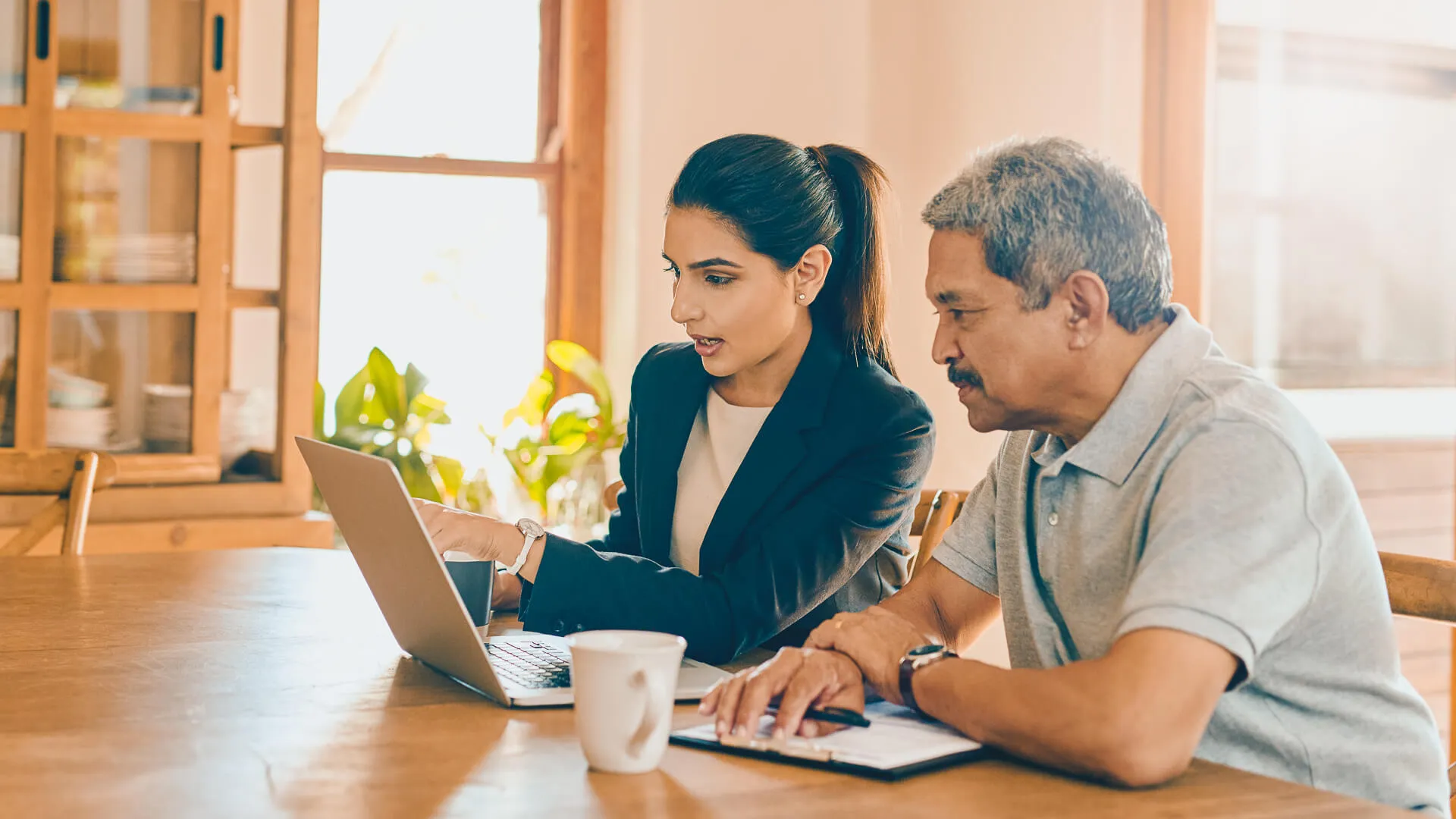 Shot of a mature man getting advice from a financial consultant at home.